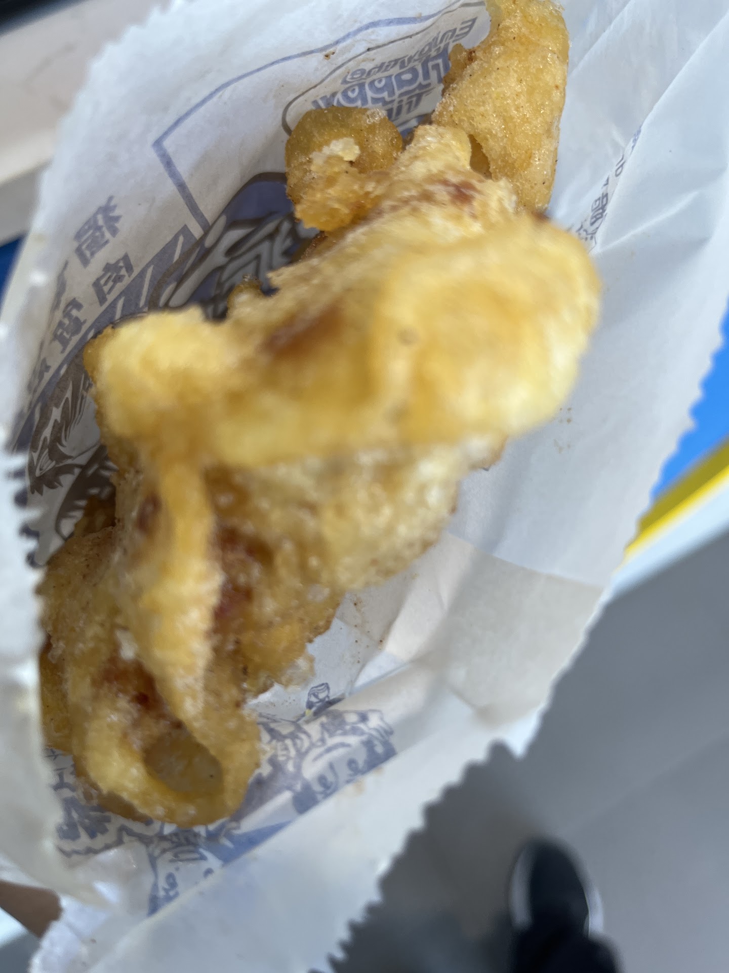Crispy chicken pieces in a Two Peck bag
